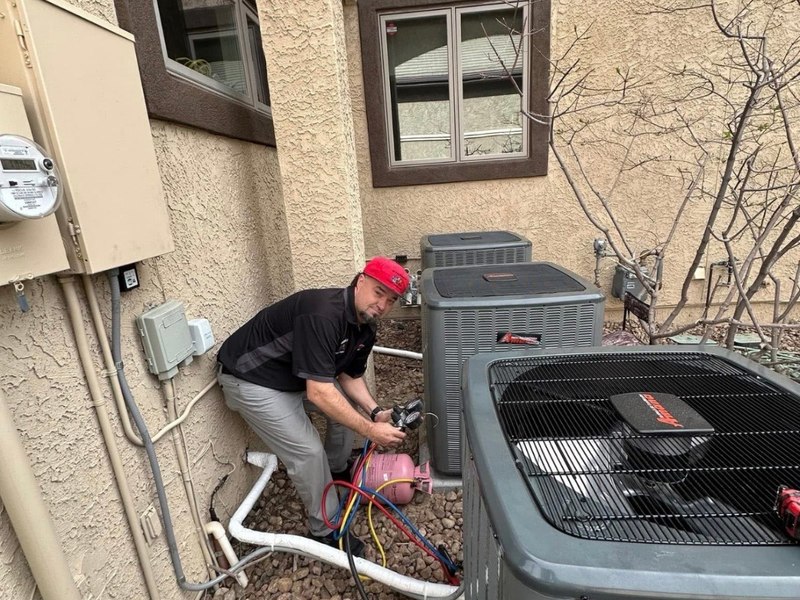Technician servicing condensers